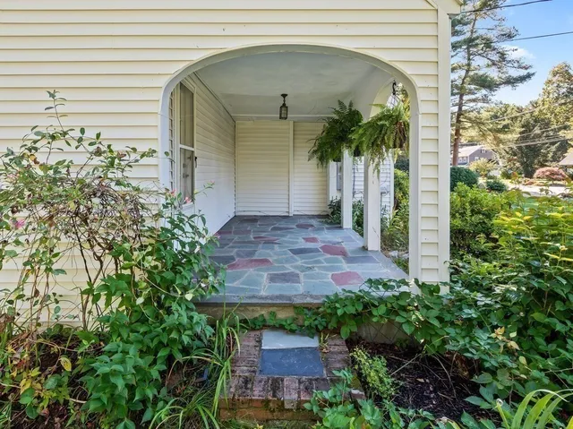 a view of a lake with a house in the background