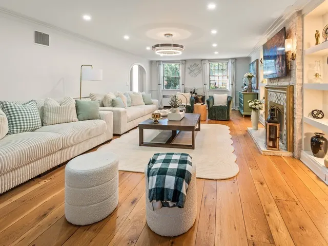 a kitchen with stainless steel appliances granite countertop a stove top oven a sink a counter space and cabinets