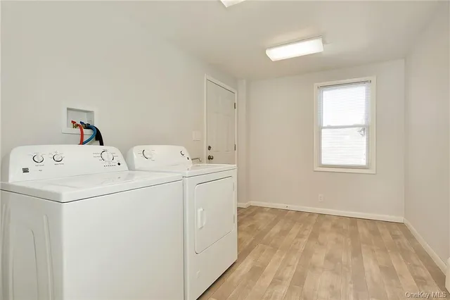 a bathroom with a sink mirror and toilet