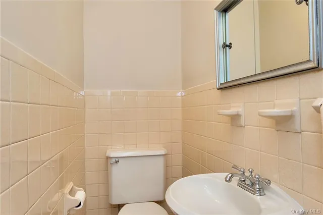 a view of a room with wooden floor and window