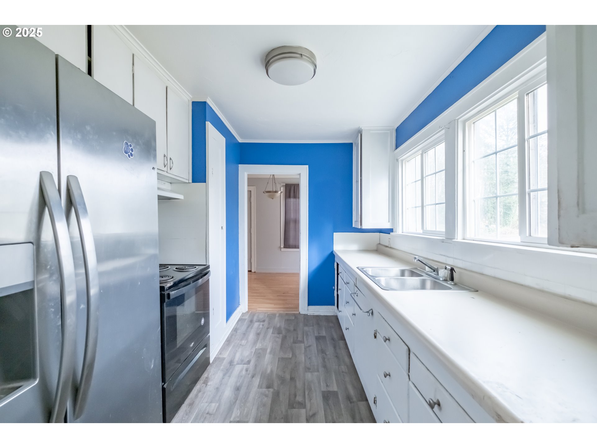 96470 Highway 99 Junction City, OR 97448 - Photo 24 of 48 a large kitchen with a sink and refrigerator