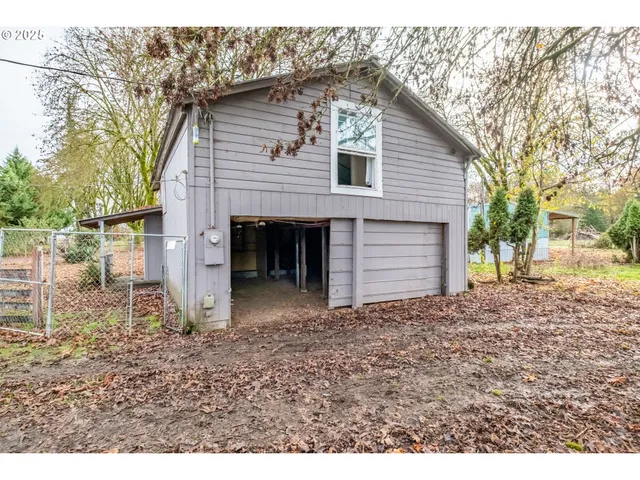 a view of a house with a yard and garage