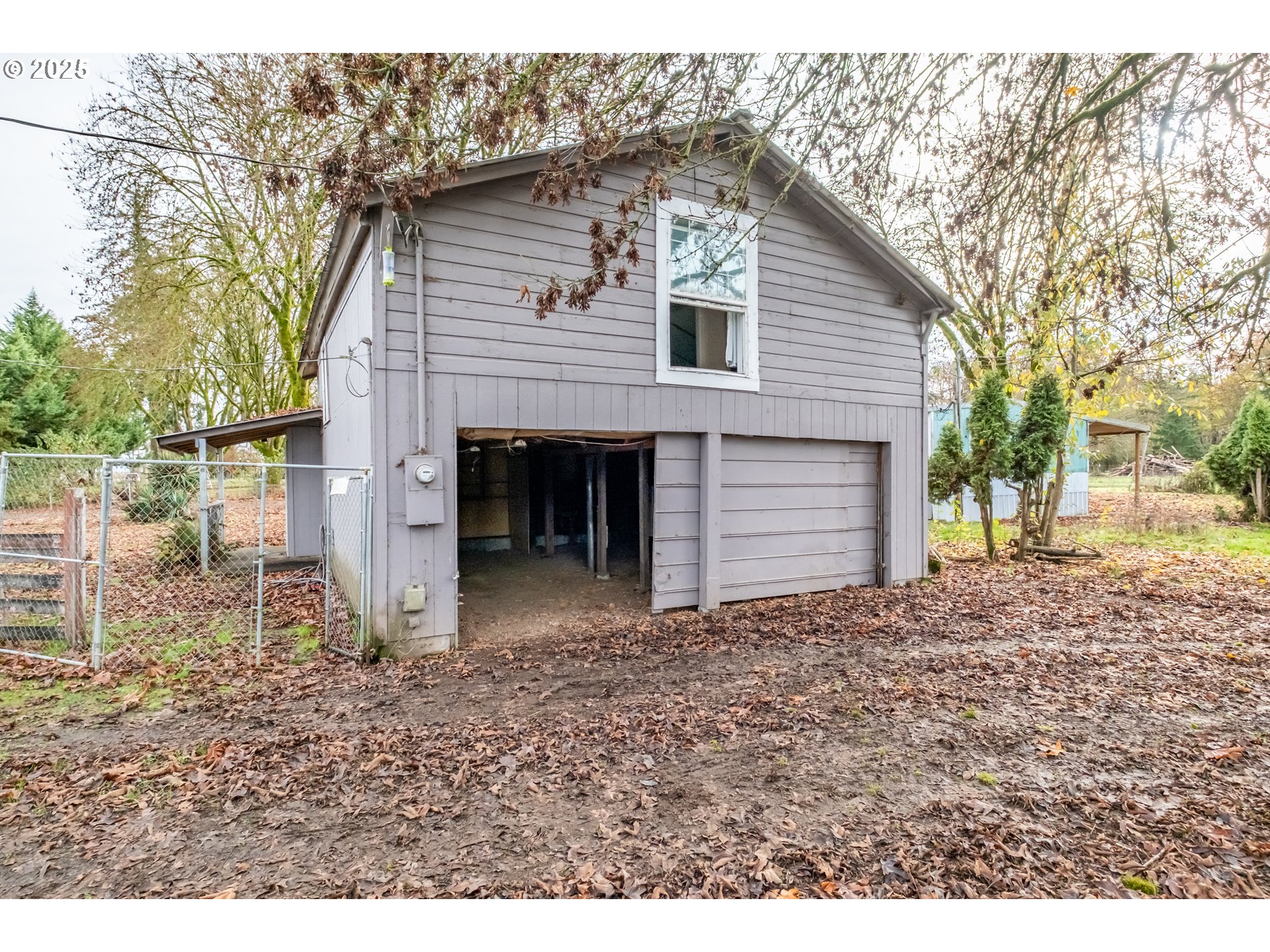96470 Highway 99 Junction City, OR 97448 - Photo 31 of 48 a view of a house with a yard and garage