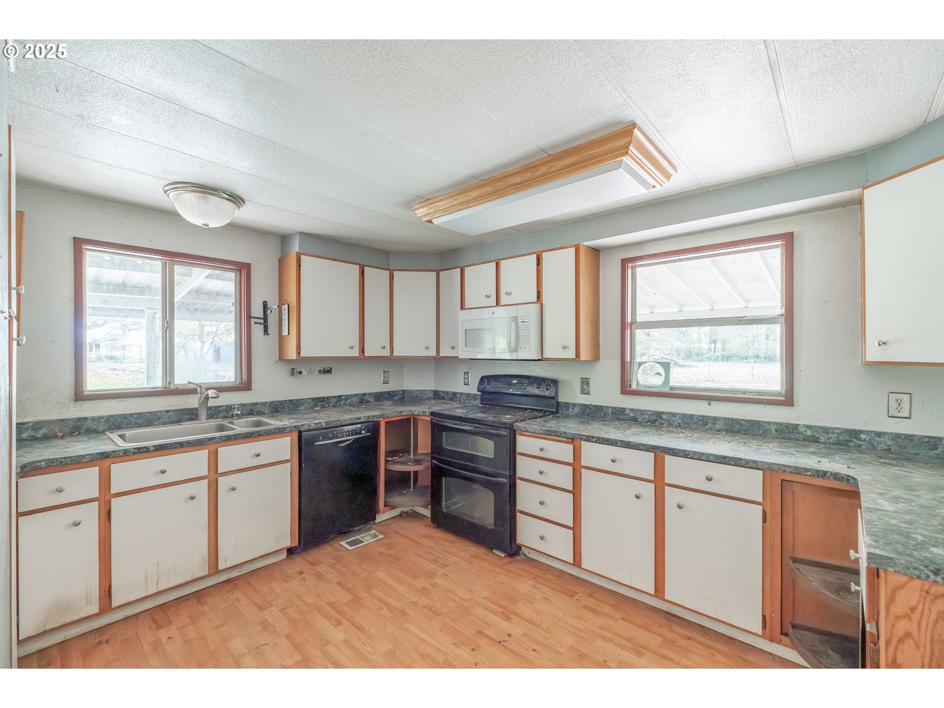 96470 Highway 99 Junction City, OR 97448 - Photo 41 of 48 a large kitchen with kitchen island granite countertop a window and a sink