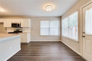 3210 Candlepine Drive Spring, TX 77388 - Photo 13 of 27 a view of a kitchen with microwave and cabinets