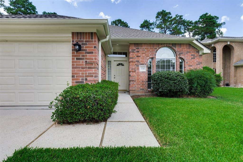 3210 Candlepine Drive Spring, TX 77388 - Photo 2 of 27 a front view of a house with garden