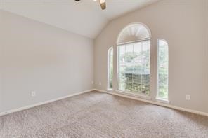 3210 Candlepine Drive Spring, TX 77388 - Photo 22 of 27 an empty room with wooden floor and windows
