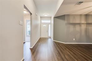 3210 Candlepine Drive Spring, TX 77388 - Photo 3 of 27 a view of an empty room with wooden floor