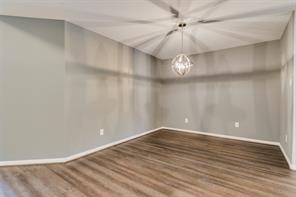 3210 Candlepine Drive Spring, TX 77388 - Photo 4 of 27 a view of a chandelier fan and wooden floor
