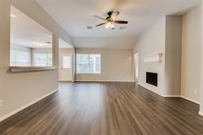 3210 Candlepine Drive Spring, TX 77388 - Photo 8 of 27 an empty room with wooden floor and windows
