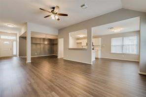 3210 Candlepine Drive Spring, TX 77388 - Photo 9 of 27 a view of an empty room with window and wooden floor