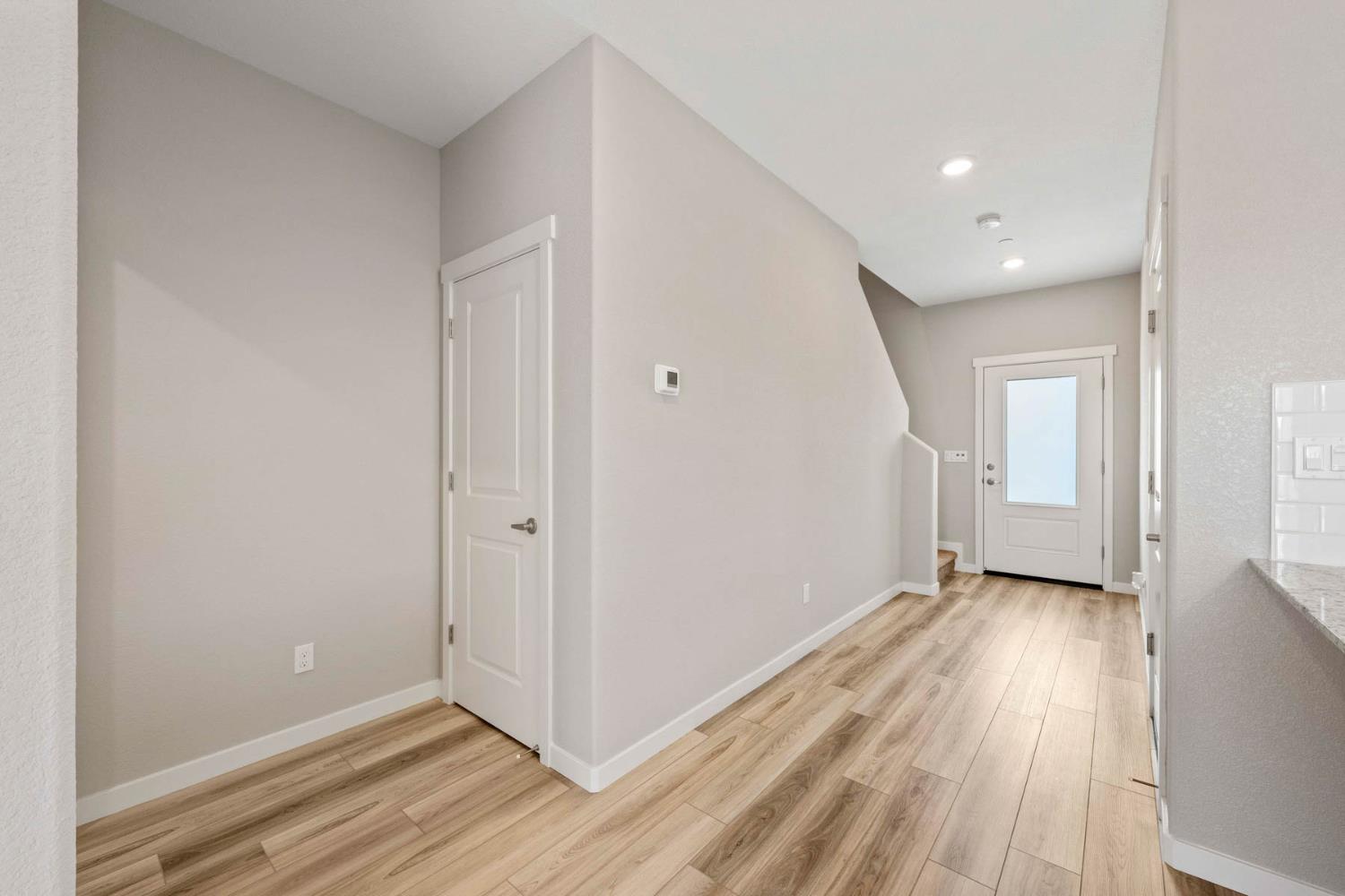 2972 Bowery Lane Lincoln, CA 95648 - Photo 2 of 23 a view of a hallway with wooden floor