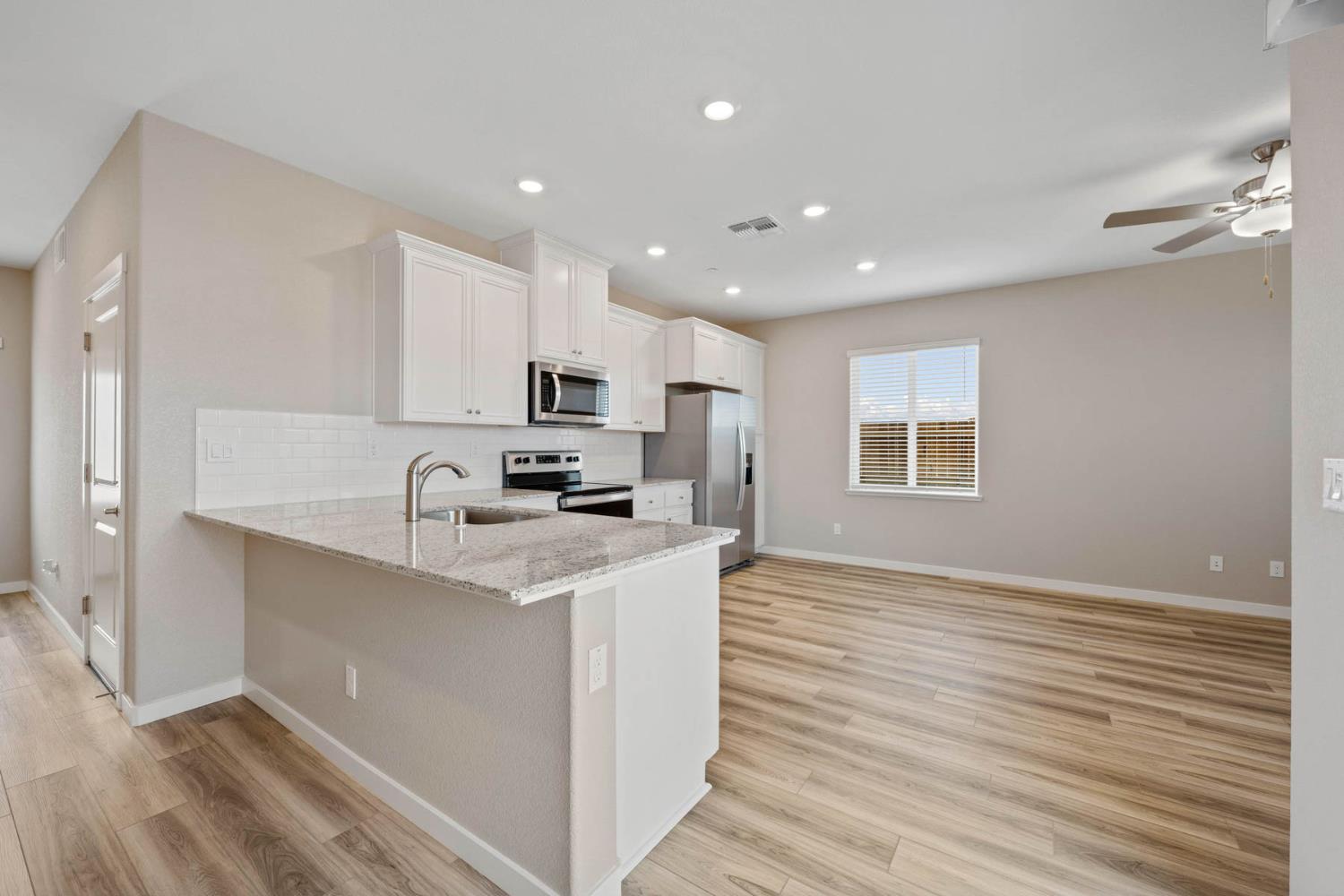 2972 Bowery Lane Lincoln, CA 95648 - Photo 4 of 23 a kitchen with stainless steel appliances granite countertop a sink stove and refrigerator