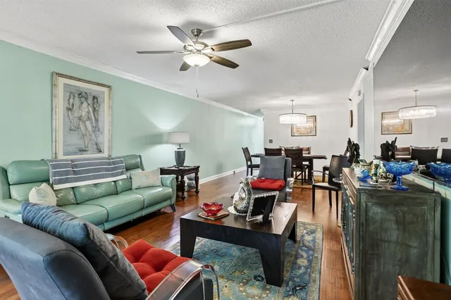 a living room with furniture kitchen view and a dining table