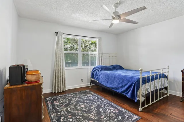 a living room with a bed and a window