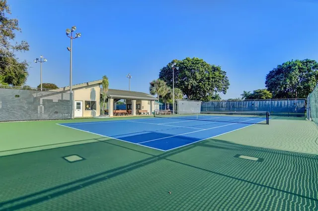 a view of outdoor space and tennis court