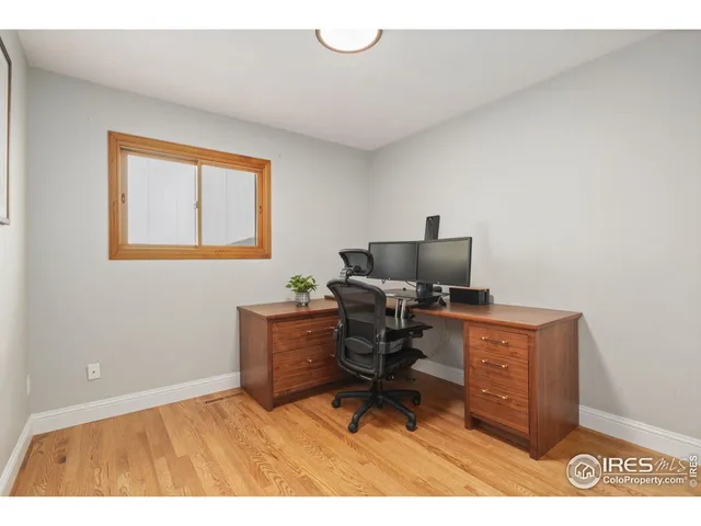 a workspace with furniture and a window