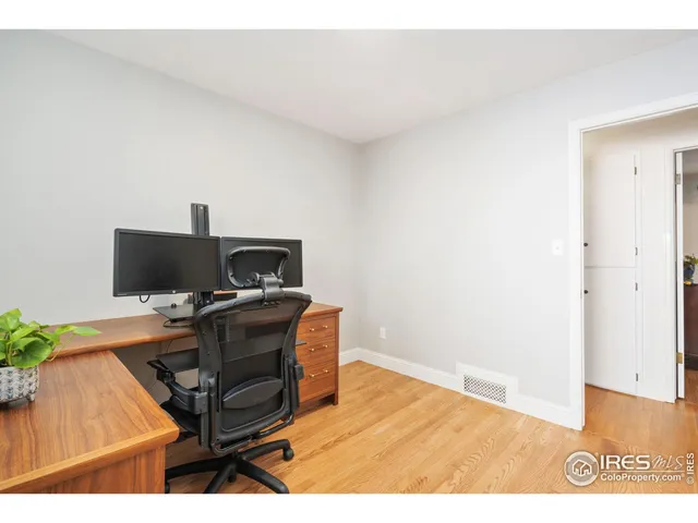 a view of workspace with wooden floor