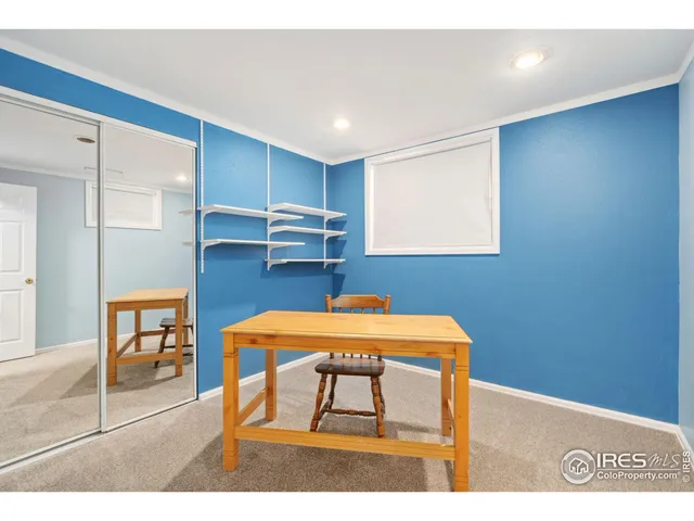 a dinning room with furniture and wooden floor