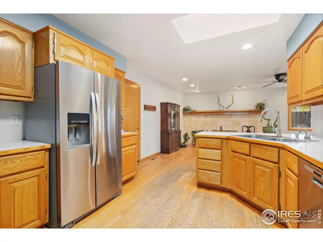 a kitchen with stainless steel appliances a refrigerator and a sink
