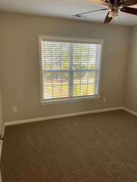 5405 Glass Ridge Road Raleigh, NC 27616 - Photo 11 of 18 a view of an empty room with a window
