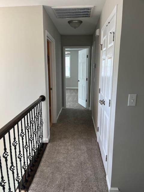 5405 Glass Ridge Road Raleigh, NC 27616 - Photo 16 of 18 a view of a hallway with a door and stairs