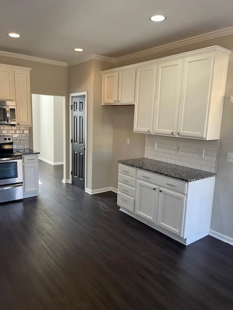 5405 Glass Ridge Road Raleigh, NC 27616 - Photo 6 of 18 a kitchen with stainless steel appliances granite countertop a stove a sink and a refrigerator