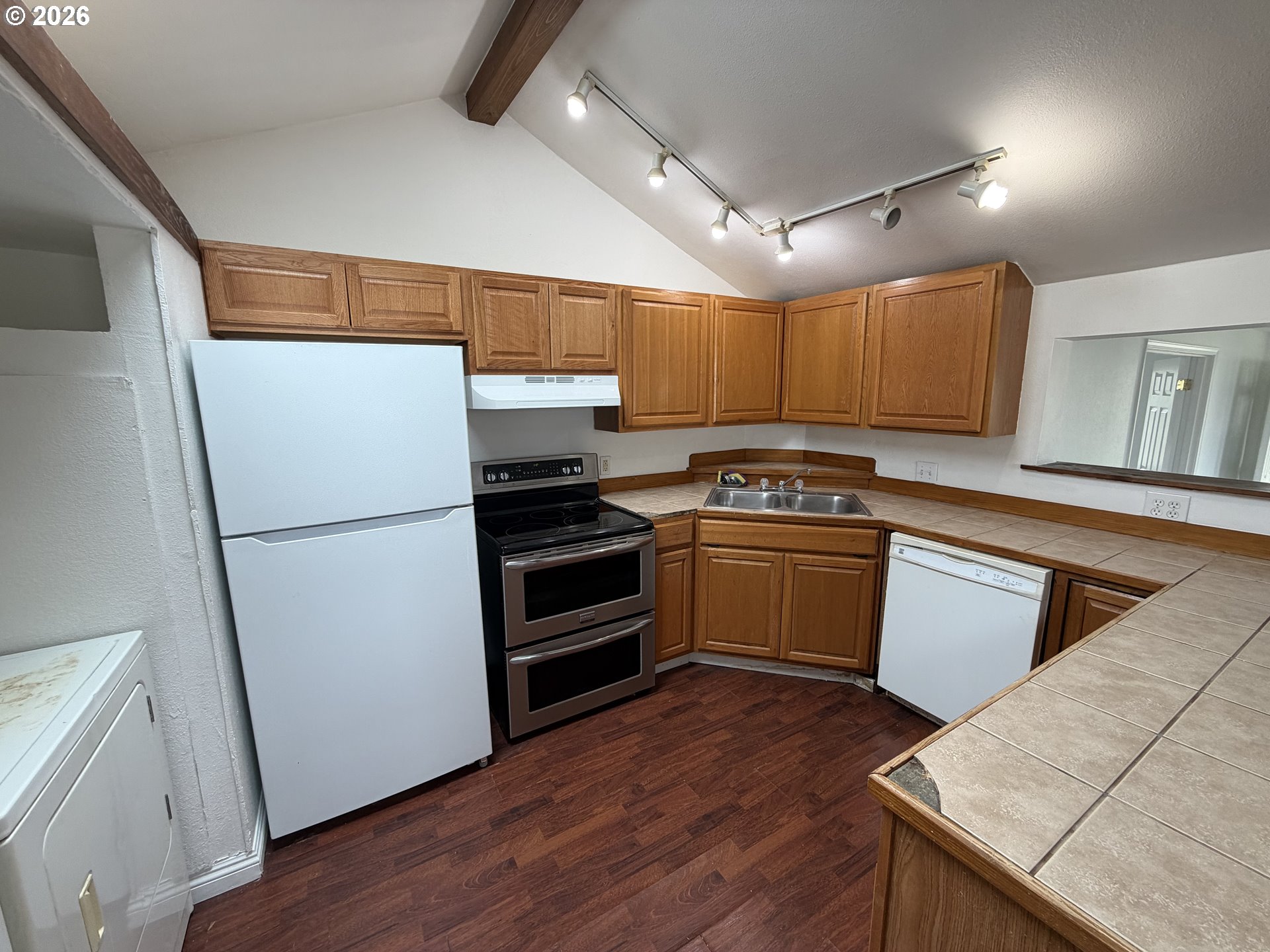 150 South 5th Street Lakeside, OR 97449 - Photo 18 of 19 a kitchen with a refrigerator and a stove top oven