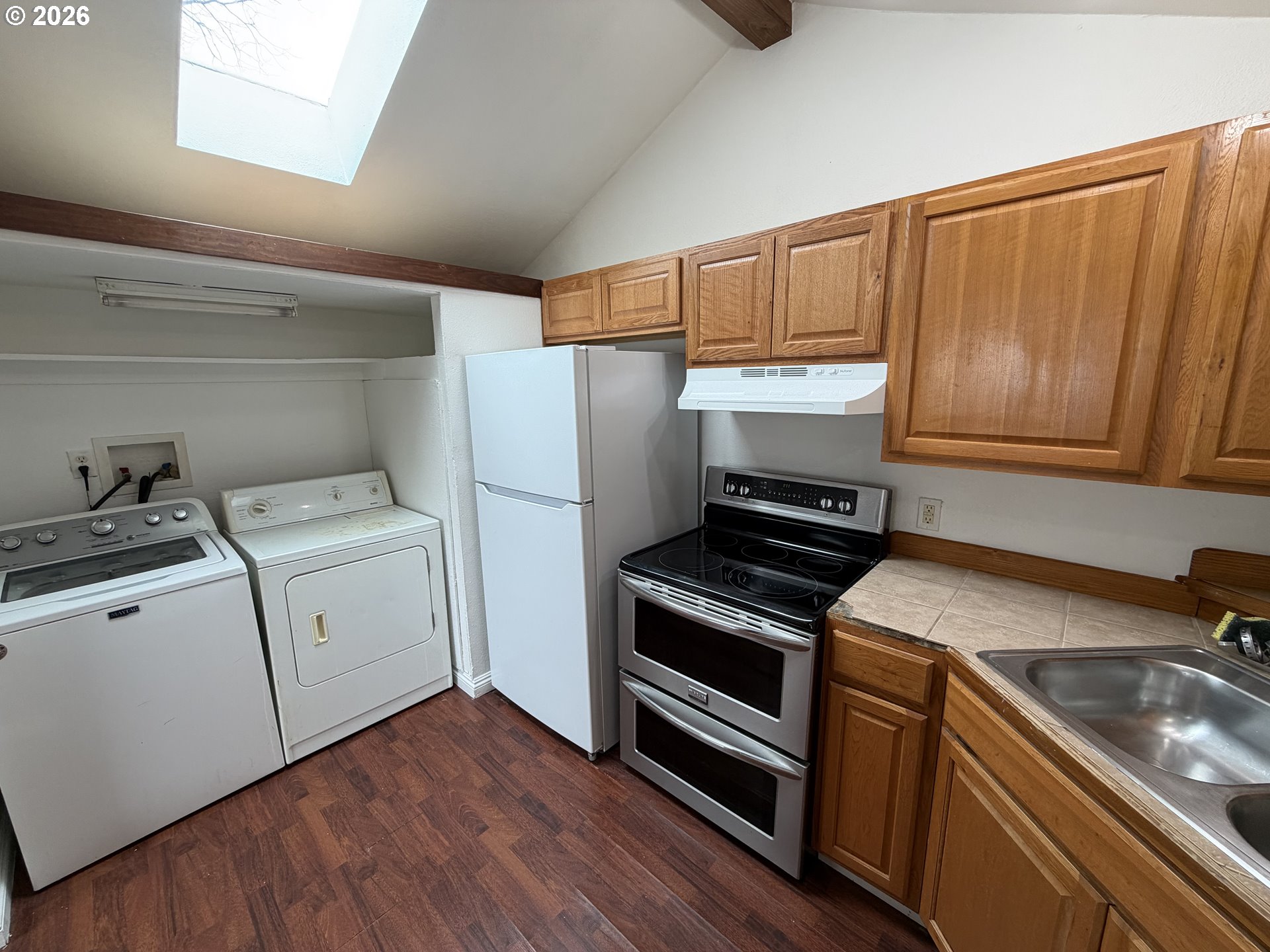 150 South 5th Street Lakeside, OR 97449 - Photo 19 of 19 a kitchen with a sink stove and refrigerator