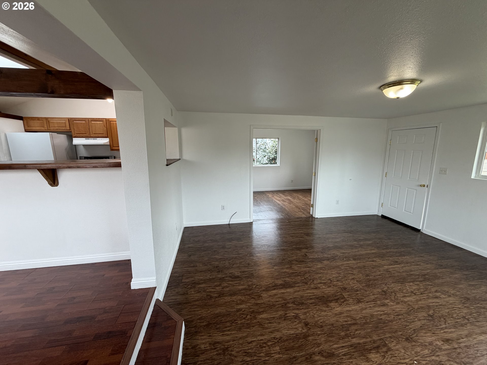 150 South 5th Street Lakeside, OR 97449 - Photo 6 of 19 a view of empty room with wooden floor