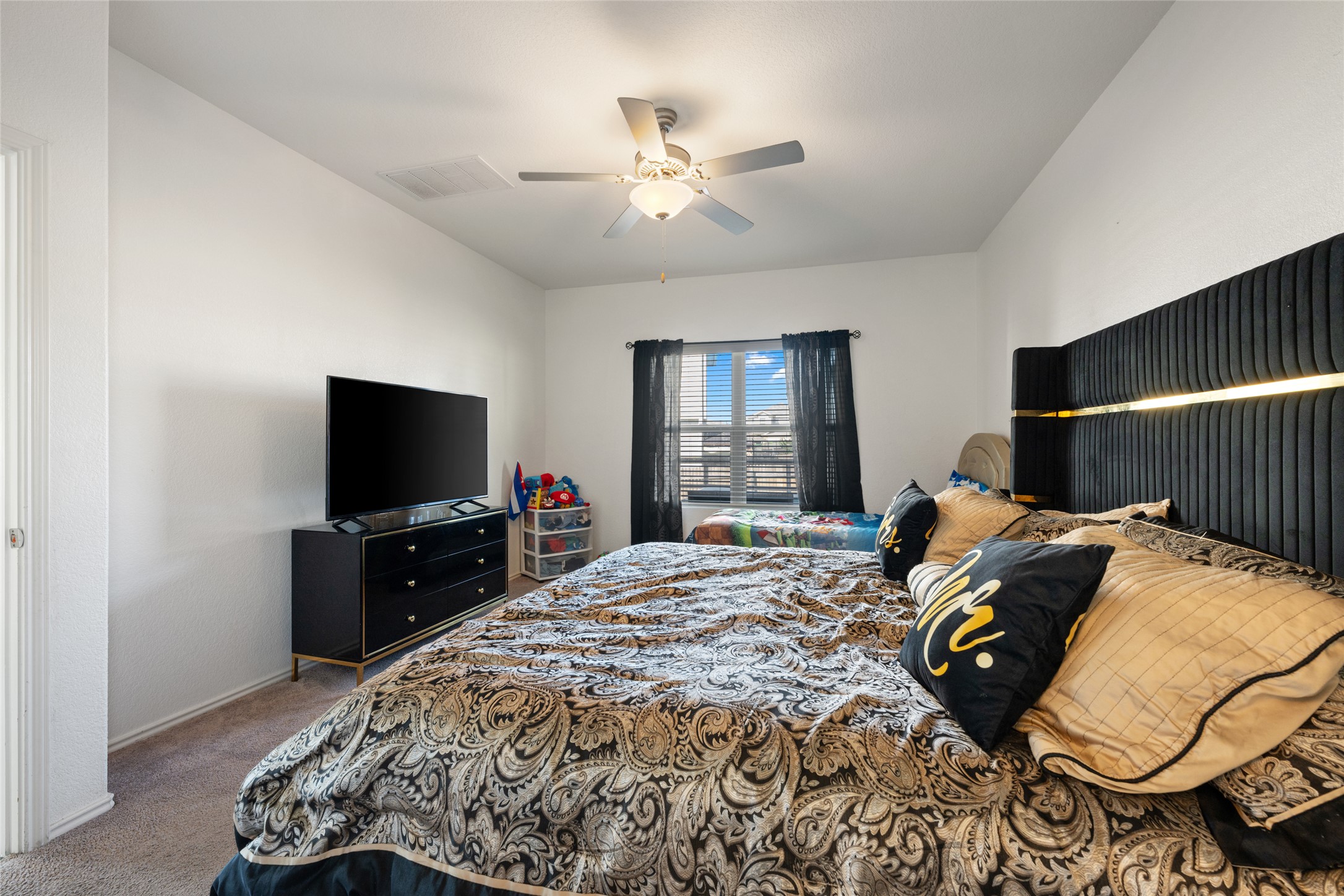 524 Circle Way, Unit 12F Jarrell, TX 76537 - Photo 16 of 34 Bedroom with carpet flooring and ceiling fan