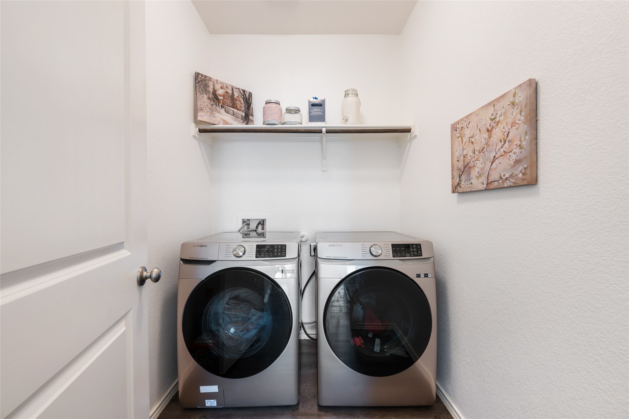 524 Circle Way, Unit 12F Jarrell, TX 76537 - Photo 20 of 34 Laundry area featuring washing machine and dryer and a textured wall