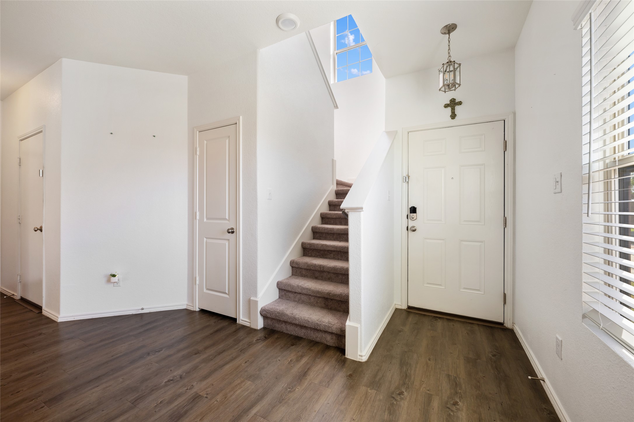 524 Circle Way, Unit 12F Jarrell, TX 76537 - Photo 22 of 34 Entrance foyer featuring stairs and dark wood-style floors