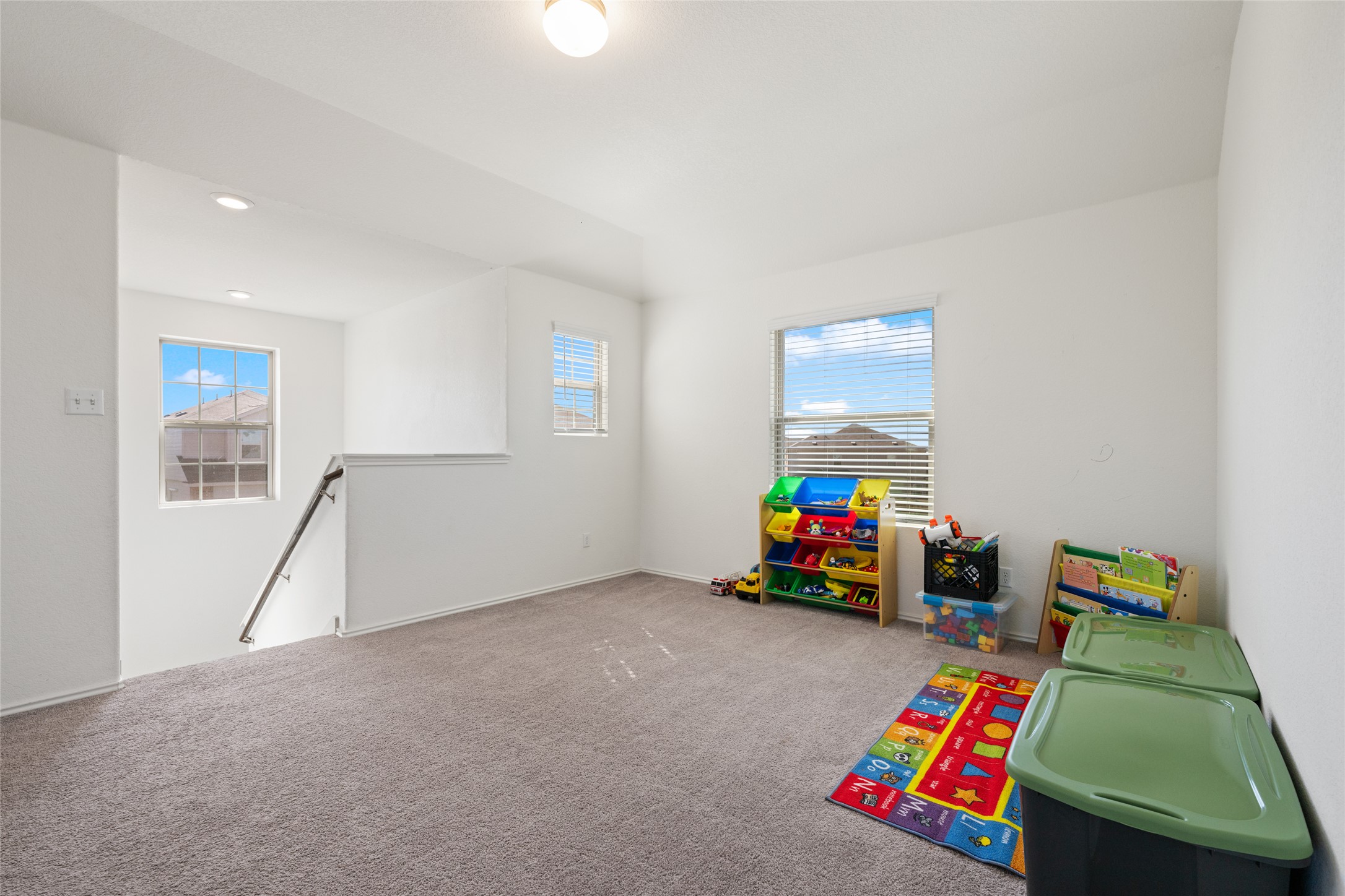 524 Circle Way, Unit 12F Jarrell, TX 76537 - Photo 23 of 34 Rec room featuring carpet and recessed lighting