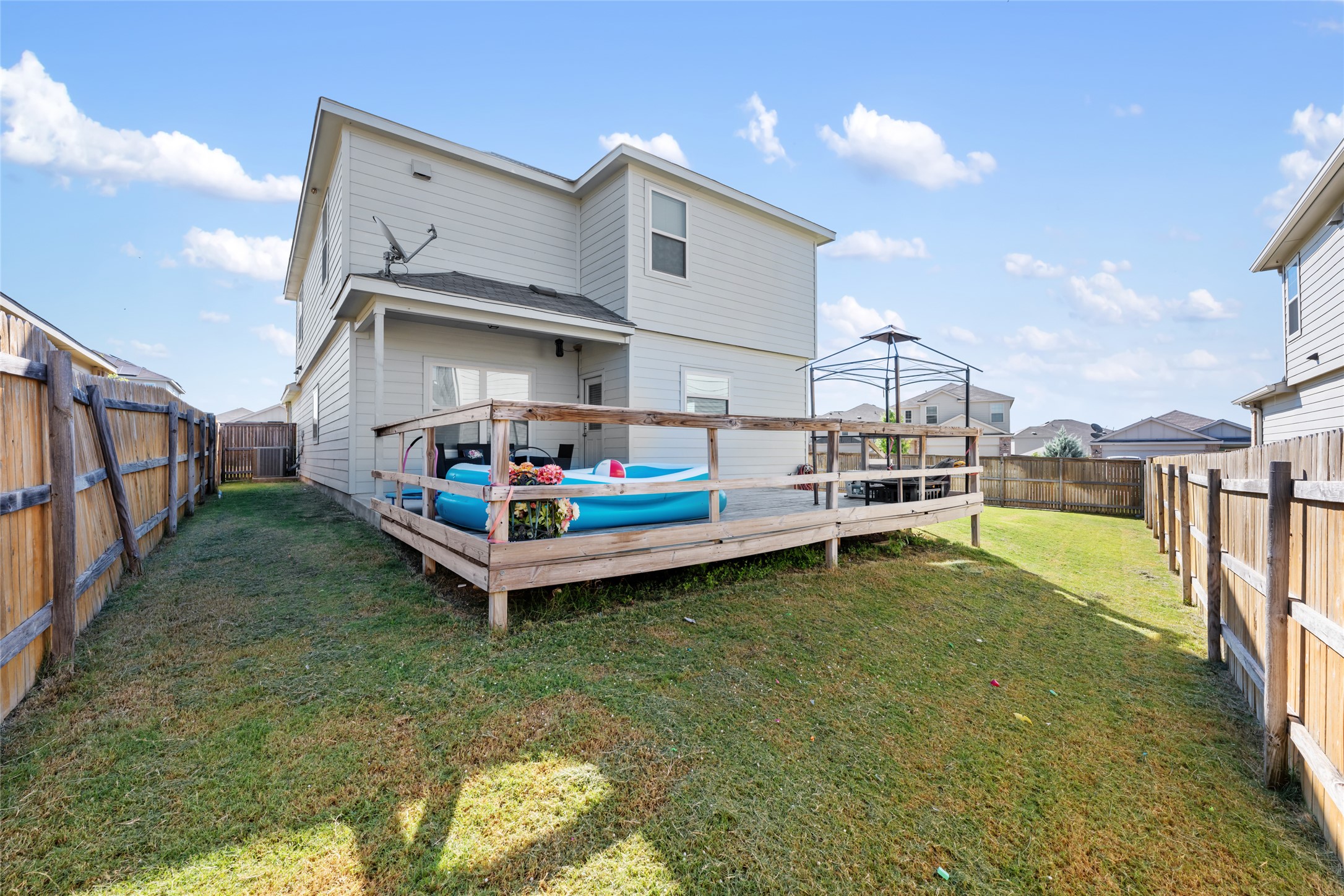 524 Circle Way, Unit 12F Jarrell, TX 76537 - Photo 32 of 34 Back of house with a deck and a fenced backyard
