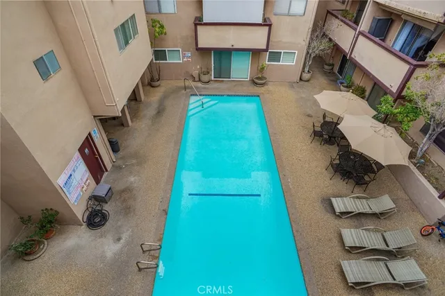 an aerial view of a house with a swimming pool