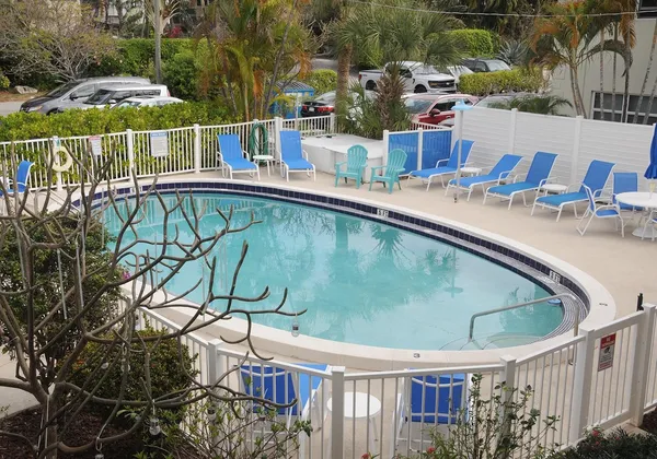 swimming pool view with a seating space