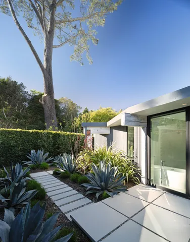 a view of a balcony with lake view and a potted plant