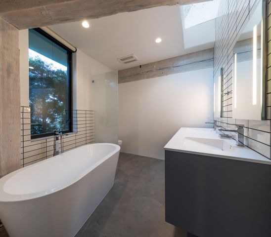 a bathroom with a bathtub and sink