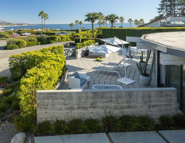 a view of a lake with a outdoor seating