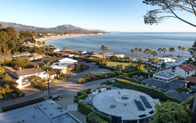 an aerial view of a house with a swimming pool yard and outdoor seating