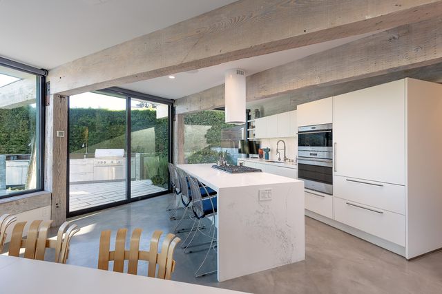 a kitchen with sink and refrigerator