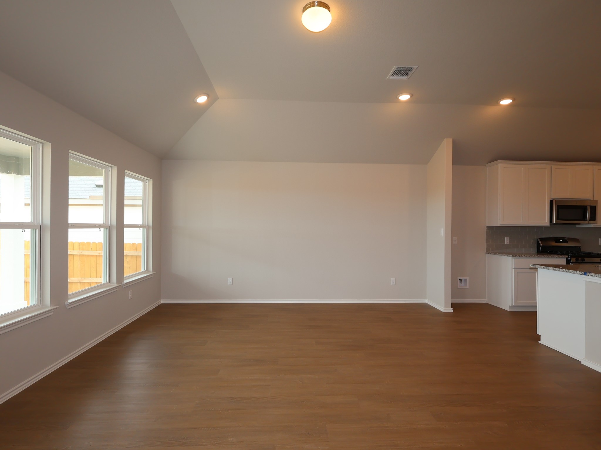 13701 Warnock Trail Manor, TX 78653 - Photo 6 of 22 a view of an empty room with a window