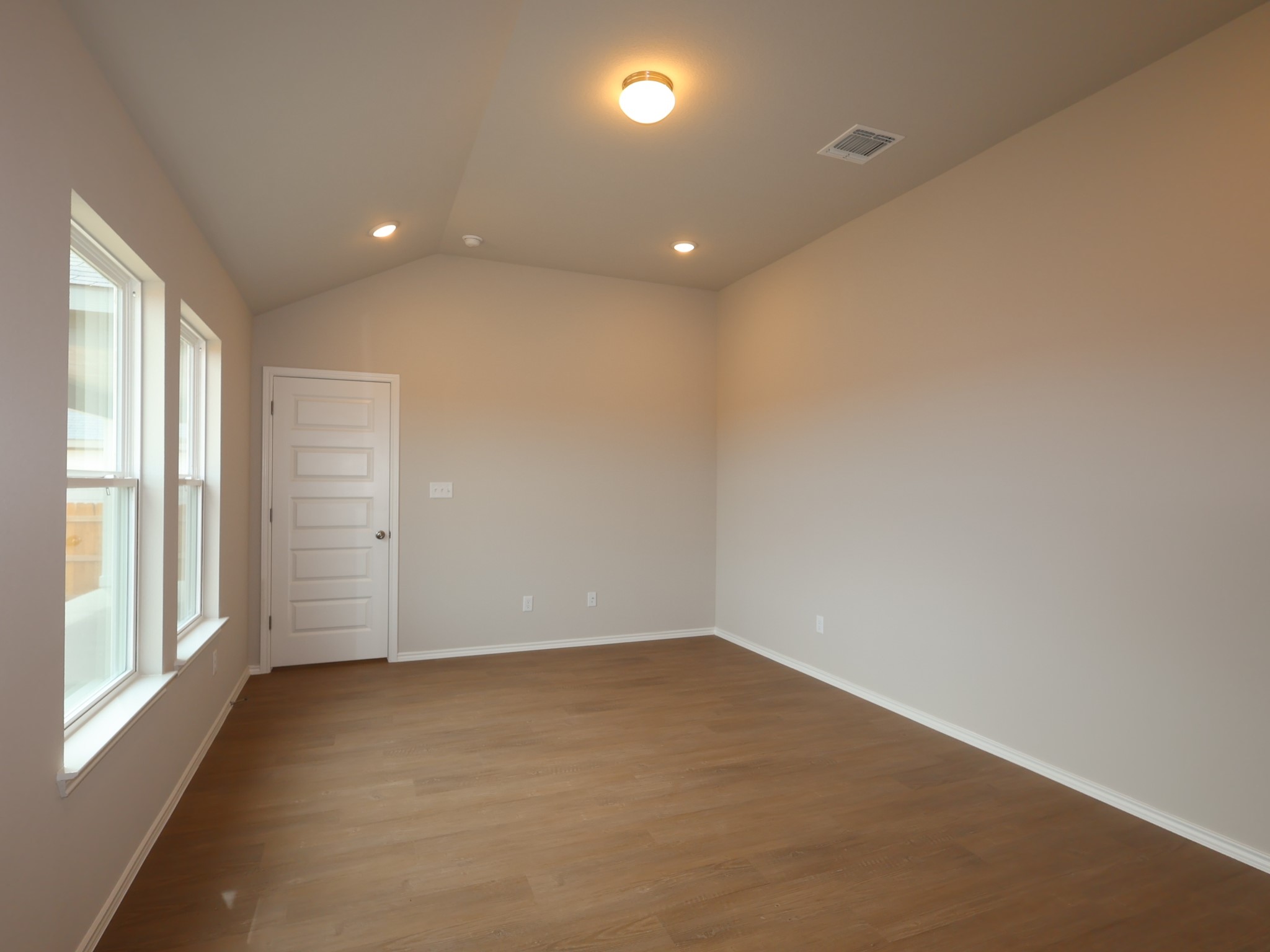 13701 Warnock Trail Manor, TX 78653 - Photo 8 of 22 en empty room with windows and entrance