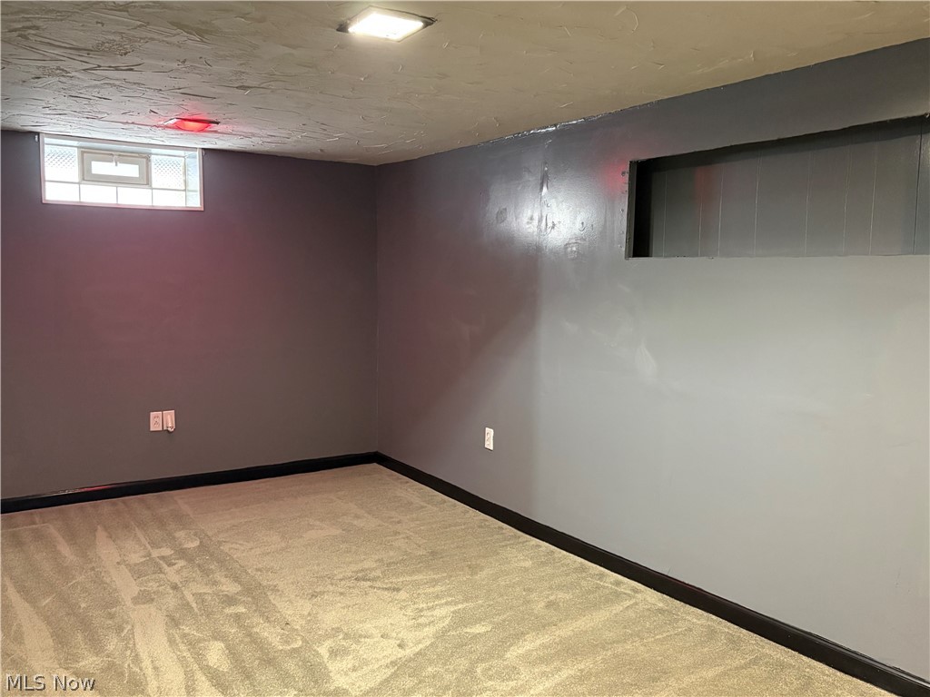 15521 Corkhill Road Maple Heights, OH 44137 - Photo 19 of 33 Basement featuring light colored carpet and baseboards