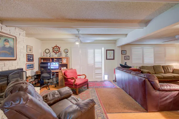 a living room with furniture and a window