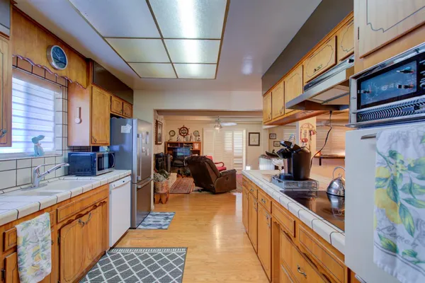 a view of a hallway view with wooden floor and staircase