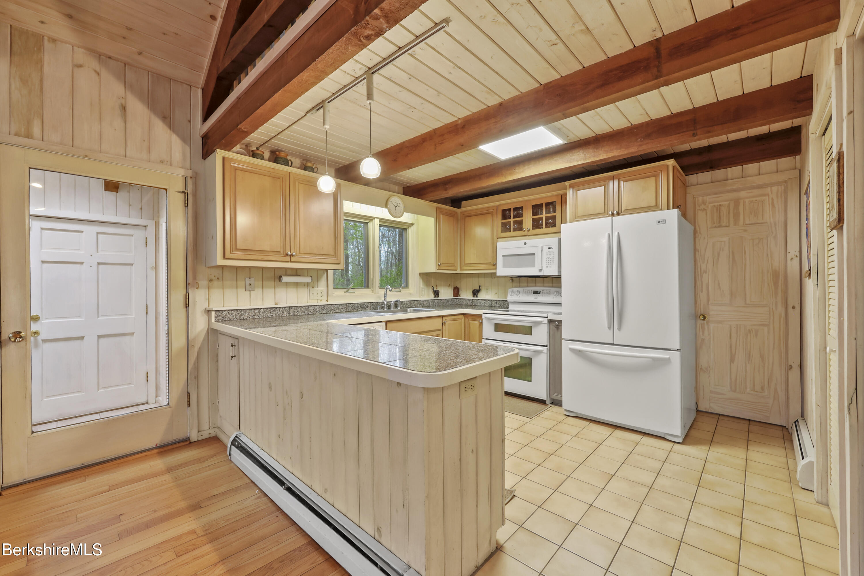 422 Bonny Rigg Hill Road Becket, MA 01223 - Photo 11 of 60 a kitchen with a refrigerator a sink and dishwasher
