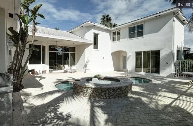 11230 Sea Grass Circle Boca Raton, FL 33498 - Photo 2 of 15 a view of a house with swimming pool