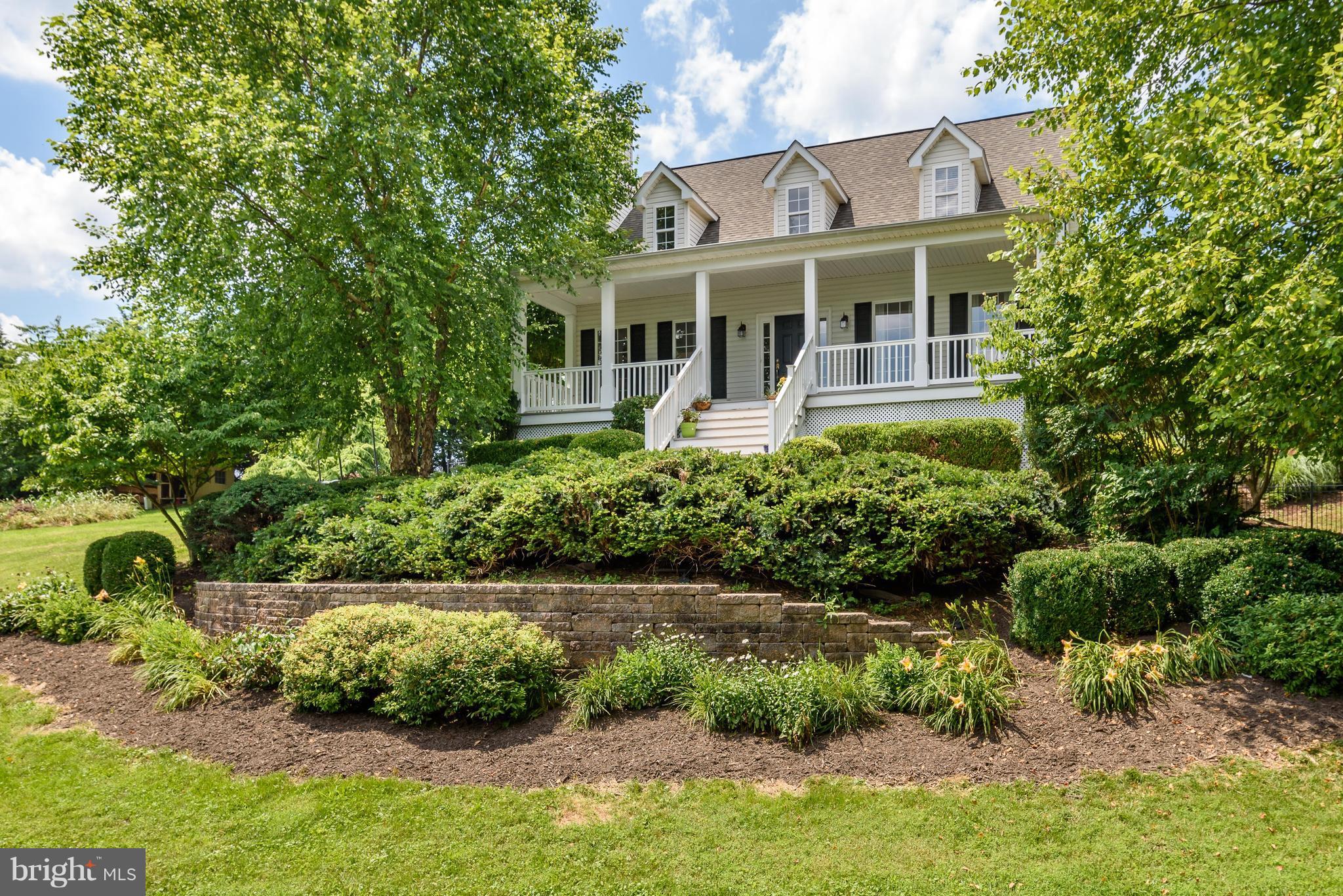 Perched on the hill with beautiful landscaping